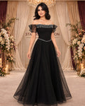 Midnight Jewel black off-shoulder evening gown with silver embellishments, full front view