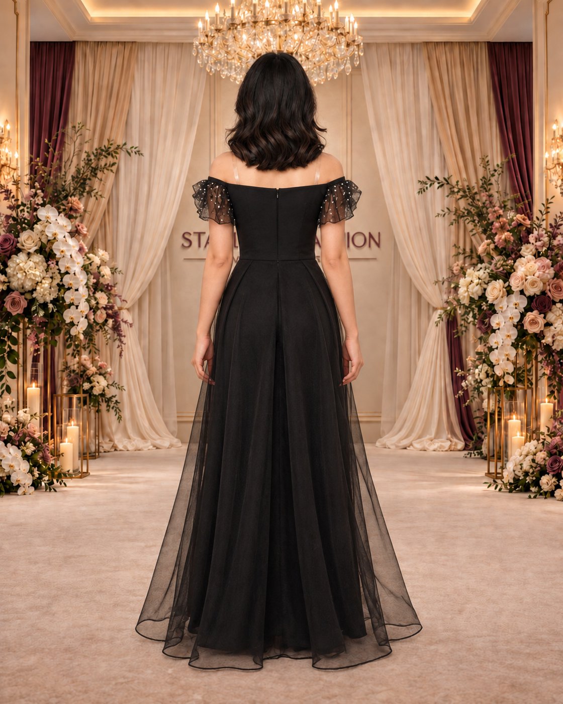 Midnight Jewel black evening gown from the back, showing the zipper and sheer sleeves